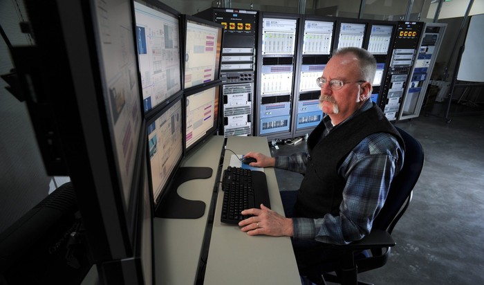 MCNC team member working in front of monitors